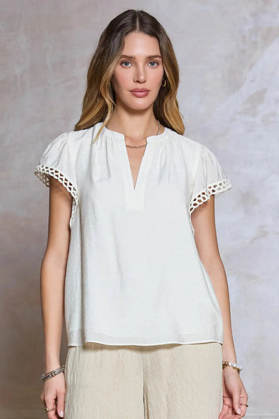 embroidered sleeve top
